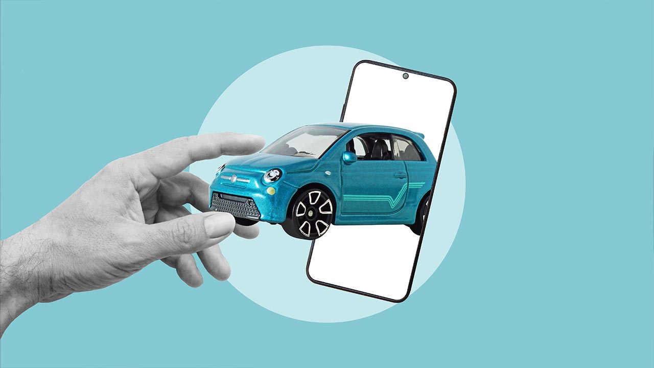 car in phone with hand reaching in
